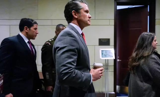 Defense Secretary Pete Hegseth arrives to brief members of Congress on military strikes near Venezuela, Tuesday, Dec. 16, 2025, at the Capitol in Washington. (AP Photo/Julia Demaree Nikhinson)