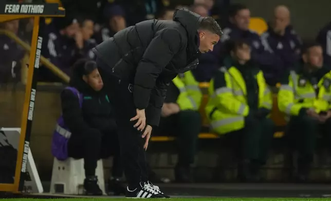 Wolverhampton Wanderers' head coach Vitor Pereira reacts during the Premier League soccer match between Wolverhampton Wandere and Manchester United in Wolverhampton, England Monday, Dec. 8, 2025. (AP Photo/Dave Shopland)