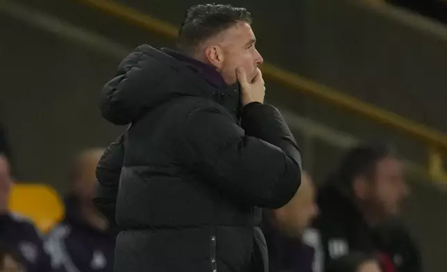 Wolverhampton Wanderers' head coach Vitor Pereira reacts during the Premier League soccer match between Wolverhampton Wandere and Manchester United in Wolverhampton, England Monday, Dec. 8, 2025. (AP Photo/Dave Shopland)