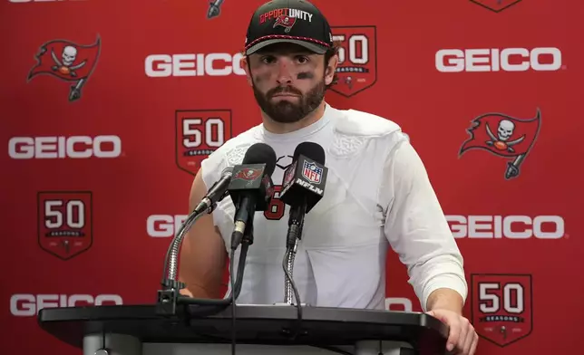 Tampa Bay Buccaneers quarterback Baker Mayfield speaks during a news conference after an NFL football game against the Miami Dolphins, Sunday, Dec. 28, 2025, in Miami Gardens, Fla. (AP Photo/Lynne Sladky)
