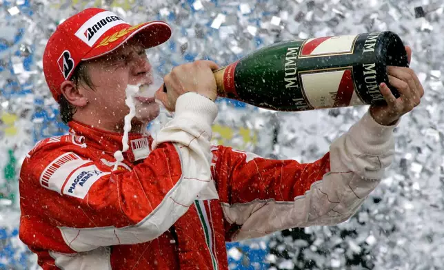 FILE - In this Oct. 21, 2007 file photo, Ferrari's driver Kimi Raikkonen of Finland celebrates after winning the Brazilian Formula One Grand Prix at the Interlagos race track in Sao Paulo, Brazil. (AP Photo/Ricardo Mazalan, File)
