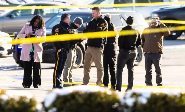 Omaha police investigate an incident at a QuikTrip gas station, that injured three officers and left the suspect dead in Omaha, Neb., Wednesday, Dec. 3, 2025. (Chris Machian/Omaha World-Herald via AP)