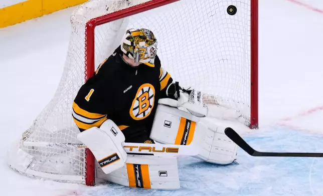 Boston Bruins goaltender Jeremy Swayman (1) looks back at the puck on a goal by Montreal Canadiens' Sammy Blais during the first period of an NHL hockey game, Tuesday, Dec. 23, 2025, in Boston. (AP Photo/Charles Krupa)