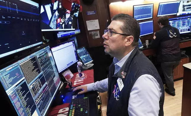 Trader Michael Capolino works on the floor of the New York Stock Exchange, Monday, Nov. 24, 2025. (AP Photo/Richard Drew)