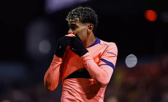 Barcelona's Lamine Yamal looks reacts during the Copa del Rey soccer match between Guadalajara and Barcelona in Guadalajara, Spain, Tuesday, Dec. 16, 2025. (AP Photo/Rudy Garcia)