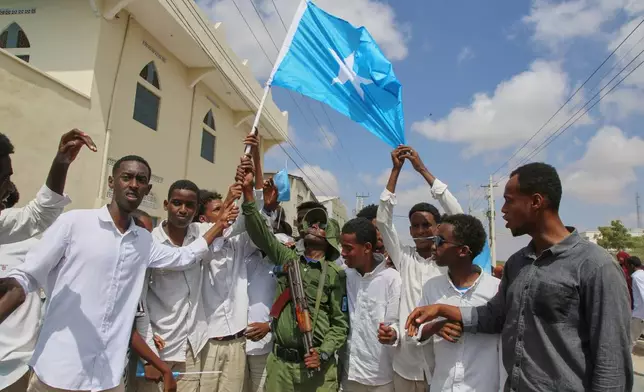 People raise Somalia's flag as they protest Israel's recognition of Somalia's breakaway region of Somaliland as an independent nation, in Mogadishu, Somalia, Tuesday, Dec. 30, 2025. (AP photo/Farah Abdi Warsameh)
