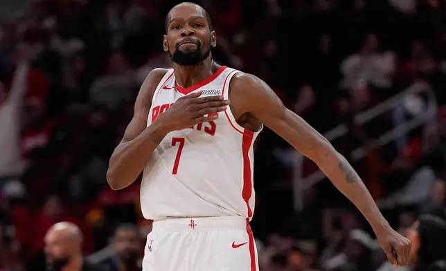 Houston Rockets forward Kevin Durant celebrates during the first half of an NBA basketball game against the Phoenix Suns in Houston, Friday, Dec. 5, 2025. (AP Photo/Ashley Landis)