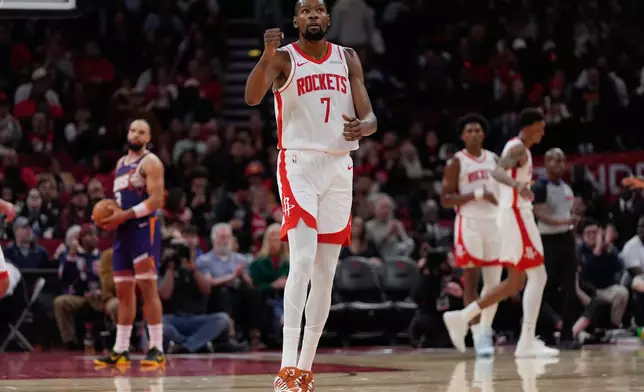 Houston Rockets forward Kevin Durant (7) celebrates during the first half of an NBA basketball game against the Phoenix Suns in Houston, Friday, Dec. 5, 2025. (AP Photo/Ashley Landis)