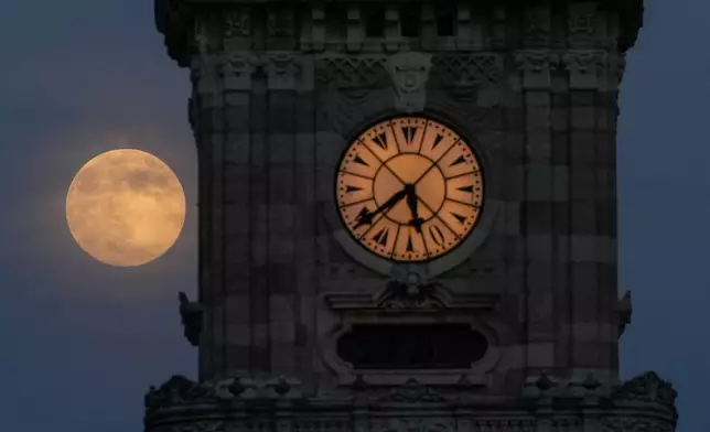 A supermoon, the last full moon of the year, rises up in the sky, in Istanbul, Turkey, Thursday, Dec. 4, 2025. (AP Photo/Emrah Gurel)