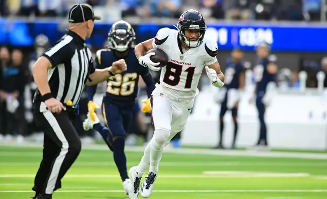 Houston Texans wide receiver Jayden Higgins (81) runs toward the end zone for a touchdown during the first half of an NFL football game against the Los Angeles Chargers Saturday, Dec. 27, 2025, in Inglewood, Calif. (AP Photo/Wally Skalij)