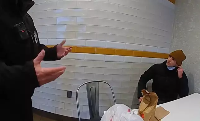 This image taken from video released by Pennsylvania State Police shows Luigi Mangione, a suspect in the fatal shooting of UnitedHealthcare CEO Brian Thompson, at a McDonald's in Altoona, Pa., on Dec. 9, 2024. (Pennsylvania State Police via AP)