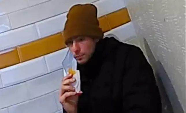 FILE - This image taken from video released by Pennsylvania State Police shows Luigi Mangione, a suspect in the fatal shooting of UnitedHealthcare CEO Brian Thompson, at a McDonald's in Altoona, Pa., on Dec. 9, 2024. (Pennsylvania State Police via AP)