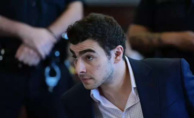 Luigi Mangione appears in Manhattan Criminal Court for an evidence hearing, Tuesday, Dec. 9, 2025, in New York. (Curtis Means/Pool Photo via AP)