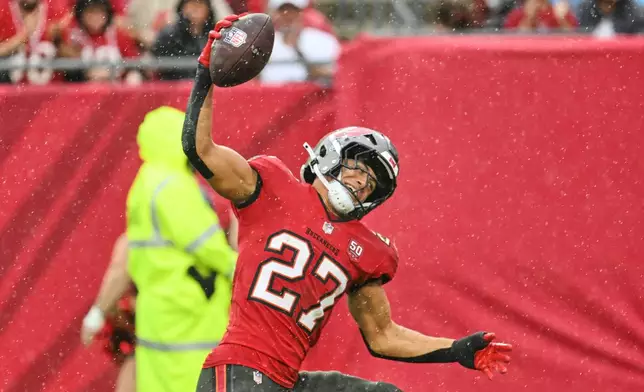 Tampa Bay Buccaneers cornerback Zyon McCollum (27) reacts after intercepting a pass against the New Orleans Saints in the first half of an NFL football game, Sunday, Dec. 7, 2025, in Tampa, Fla. (AP Photo/Jason Behnken)