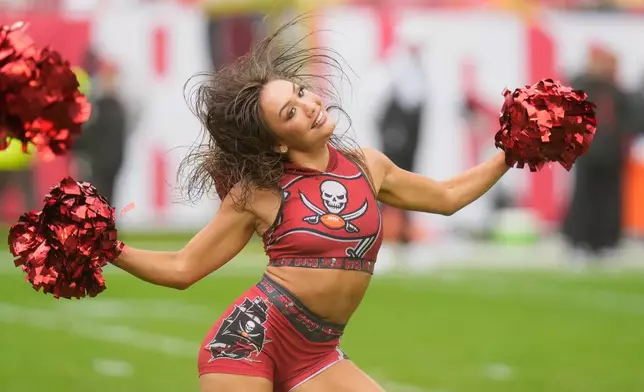 A Tampa Bay Buccaneers cheerleader performs in the second half of an NFL football game against the New Orleans Saints, Sunday, Dec. 7, 2025, in Tampa, Fla. (AP Photo/Chris O'Meara)