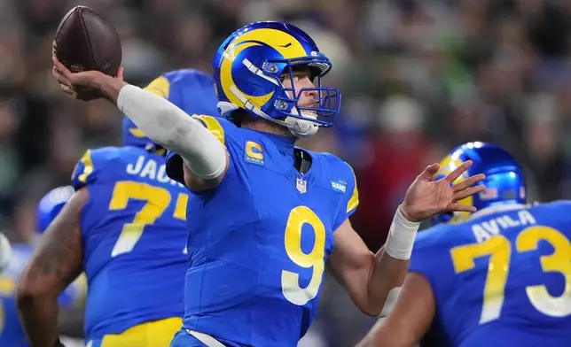 Los Angeles Rams quarterback Matthew Stafford (9) throws during the second half of an NFL football game against the Seattle Seahawks, Thursday, Dec. 18, 2025, in Seattle. (AP Photo/Lindsey Wasson)