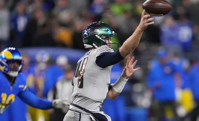 Seattle Seahawks quarterback Sam Darnold throws during the second half of an NFL football game against the Los Angeles Rams, Thursday, Dec. 18, 2025, in Seattle. (AP Photo/Lindsey Wasson)