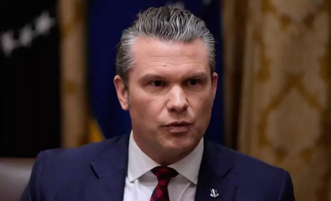 Defense Secretary Pete Hegseth speaks during a Cabinet meeting at the White House, Tuesday, Dec. 2, 2025, in Washington. (AP Photo/Julia Demaree Nikhinson)