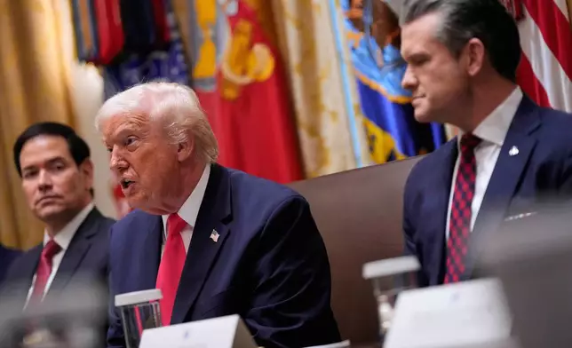 President Donald Trump speaks during a Cabinet meeting at the White House, Tuesday, Dec. 2, 2025, in Washington, as Secretary of State Marco Rubio and Defense Secretary Pete Hegseth, look on. (AP Photo/Julia Demaree Nikhinson)