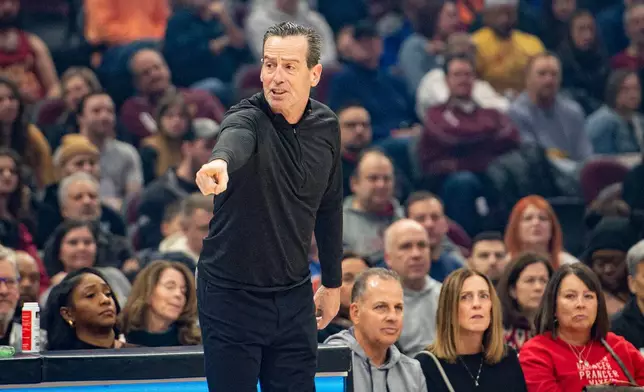 Cleveland Cavaliers head coach Kenny Atkinson directs his team against the Charlotte Hornets during the first half of an NBA basketball game, in Cleveland, Sunday, Dec. 14, 2025. (AP Photo/Phil Long)