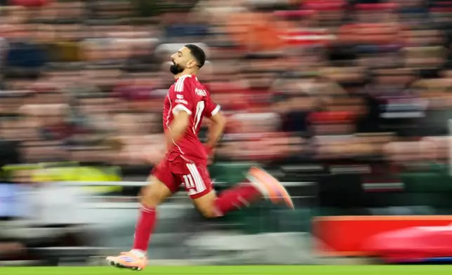 Liverpool's Mohamed Salah in action during the English Premier League soccer match between Liverpool and Brighton and Hove Albion in Liverpool, England, Saturday, Dec. 13, 2025. (AP Photo/Jon Super)