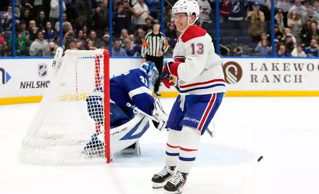 Montréal Canadiens right wing Cole Caufield (13) reacts after Tampa Bay Lightning goaltender Jonas Johansson (31) makes a save during a shootout in an NHL hockey game Sunday, Dec. 28, 2025, in Tampa, Fla. (AP Photo/Chris O'Meara)