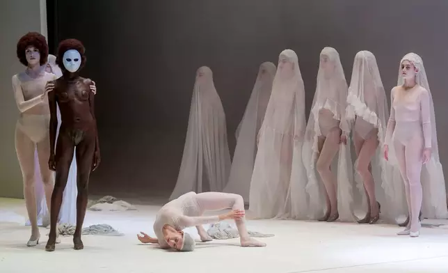 EDS NOTE: NUDITY - Actors perform during the general rehearsal of Ennio Morricone's only opera, Partenope, at the San Carlo Theatre, in Naples, Italy, Thursday, Dec. 11, 2025. (AP Photo/Salvatore Laporta)