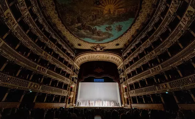 Actors perform during the general rehearsal of Ennio Morricone's only opera, Partenope, at the San Carlo Theatre, in Naples, Italy, Thursday, Dec. 11, 2025. (AP Photo/Salvatore Laporta)