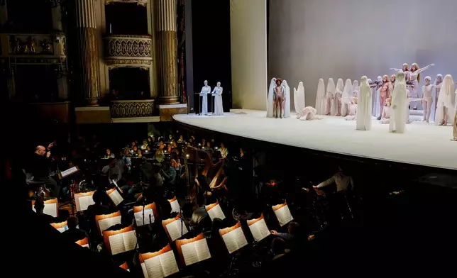 Actors perform during the general rehearsal of Ennio Morricone's only opera, Partenope, at the San Carlo Theatre, in Naples, Italy, Thursday, Dec. 11, 2025. (AP Photo/Salvatore Laporta)
