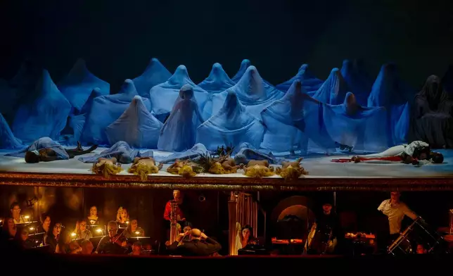 Actors perform during the general rehearsal of Ennio Morricone's only opera, Partenope, at the San Carlo Theatre, in Naples, Italy, Thursday, Dec. 11, 2025. (AP Photo/Salvatore Laporta)