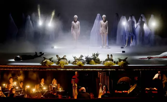 Actors perform during the general rehearsal of Ennio Morricone's only opera, Partenope, at the San Carlo Theatre, in Naples, Italy, Thursday, Dec. 11, 2025. (AP Photo/Salvatore Laporta)