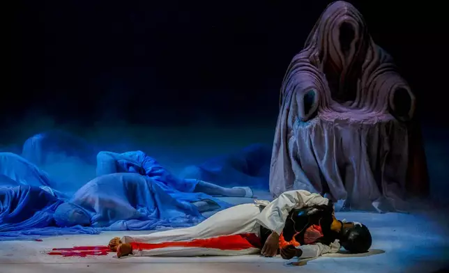 Actors perform during the general rehearsal of Ennio Morricone's only opera, Partenope, at the San Carlo Theatre, in Naples, Italy, Thursday, Dec. 11, 2025. (AP Photo/Salvatore Laporta)