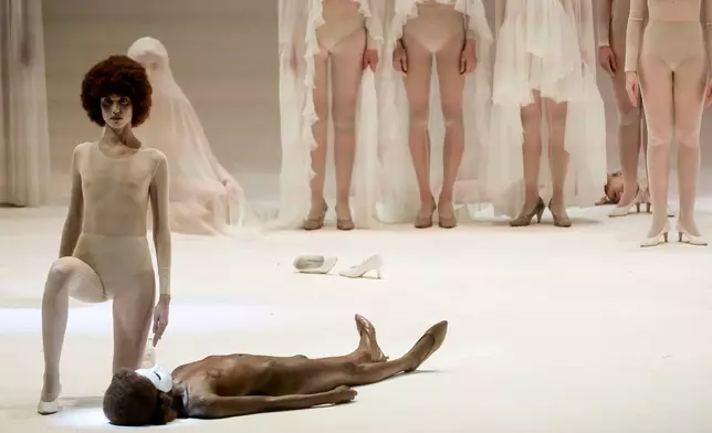 EDS NOTE: NUDITY - Actors perform during the general rehearsal of Ennio Morricone's only opera, Partenope, at the San Carlo Theatre, in Naples, Italy, Thursday, Dec. 11, 2025. (AP Photo/Salvatore Laporta)