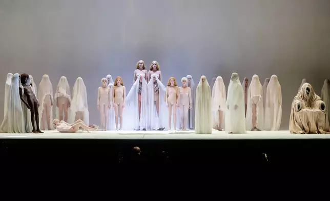 EDS NOTE: NUDITY - Actors perform during the general rehearsal of Ennio Morricone's only opera, Partenope, at the San Carlo Theatre, in Naples, Italy, Thursday, Dec. 11, 2025. (AP Photo/Salvatore Laporta)