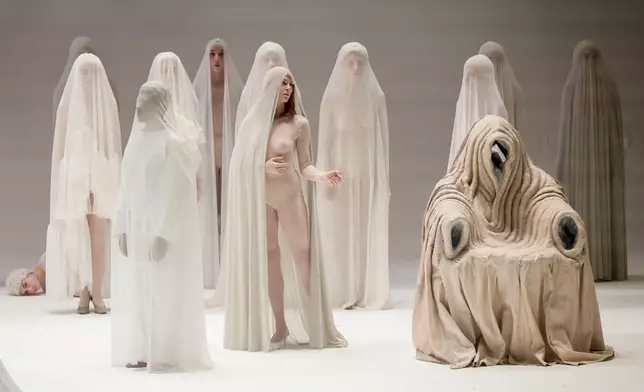 EDS NOTE: NUDITY - Actors perform during the general rehearsal of Ennio Morricone's only opera, Partenope, at the San Carlo Theatre, in Naples, Italy, Thursday, Dec. 11, 2025. (AP Photo/Salvatore Laporta)