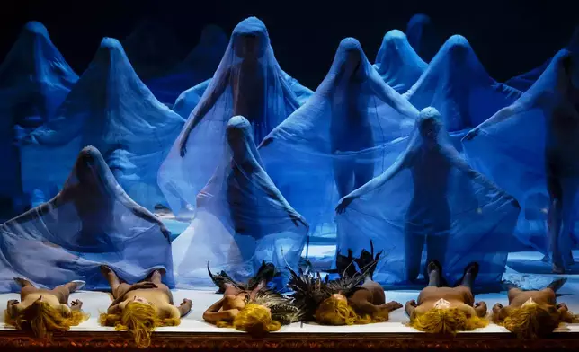 EDS NOTE: NUDITY - Actors perform during the general rehearsal of Ennio Morricone's only opera, Partenope, at the San Carlo Theatre, in Naples, Italy, Thursday, Dec. 11, 2025. (AP Photo/Salvatore Laporta)