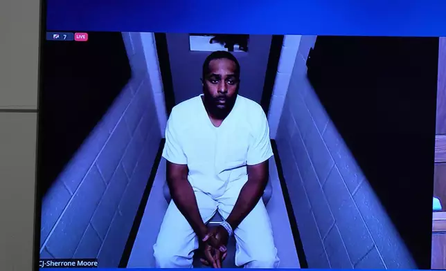 Michigan football coach Sherrone Moore appears via video in court on Friday, Dec. 12, 2025 in Ann Arbor, Mich. (AP Photo/ Ryan Sun)