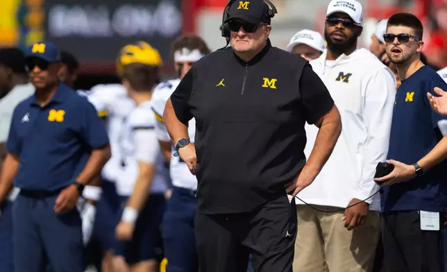 FILE - Michigan acting head coach Biff Poggi watches as his team plays against Nebraska during the first half of an NCAA college football game Saturday, Sept. 20, 2025, in Lincoln, Neb. (AP Photo/Rebecca S. Gratz, File)