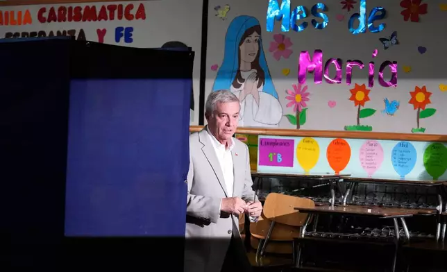 Jose Antonio Kast, presidential candidate for the Republican Party, prepares to vote during the presidential runoff election in Santiago, Chile, Sunday, Dec. 14, 2025. (AP Photo/Matias Delacroix)
