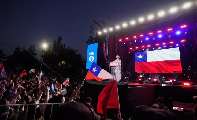 Presidential candidate Jeannette Jara of the Unidad por Chile coalition addresses supporters during a rally ahead of the presidential runoff election in Santiago, Chile, Wednesday, Dec. 10, 2025. (AP Photo/Natacha Pisarenko)