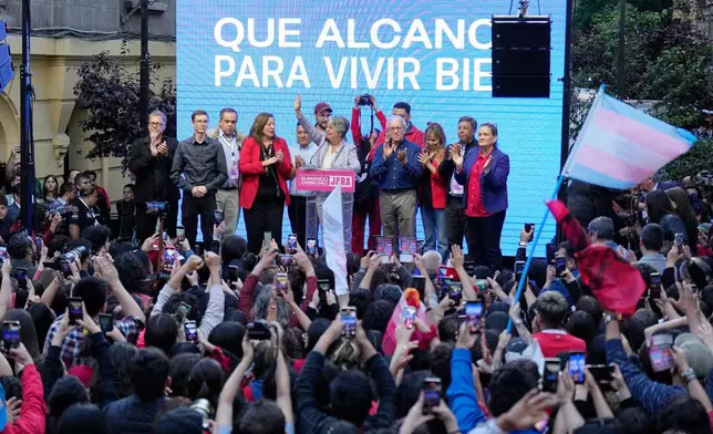Presidential candidate Jeannette Jara, of the ruling Unity for Chile coalition, addresses supporters after conceding to Jose Antonio Kast, of the opposition Republican Party, in the presidential runoff election in Santiago, Chile, Sunday, Dec. 14, 2025. (AP Photo/Natacha Pisarenko)