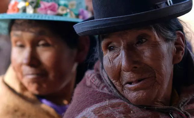Voters stand in line at a polling station during general elections in Jesus de Machaca, Bolivia, Aug. 17, 2025. (AP Photo/Juan Karita, File)