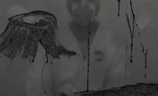 MUNDANO, a Brazilian artist, uses ashes collected from wildfires as he participates in a demonstration to raise awareness against forest destruction at the COP30 U.N. Climate Summit, Nov. 18, 2025, in Belem, Brazil. (AP Photo/Joshua A. Bickel, File)