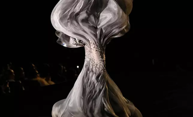 A model wears a creation from the Stephane Rolland Haute Couture Spring Summer 2025 collection, presented in Paris, Jan. 28, 2025. (AP Photo/Thibault Camus, File)