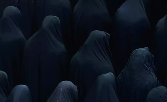 Shiite Muslim women perform their prayer at the shrine of Saint Abdulazim in Shahr-e-Ray, south of Tehran, Iran, Aug. 14, 2025, during a ceremony to observe the Arbaeen. (AP Photo/Vahid Salemi, File)