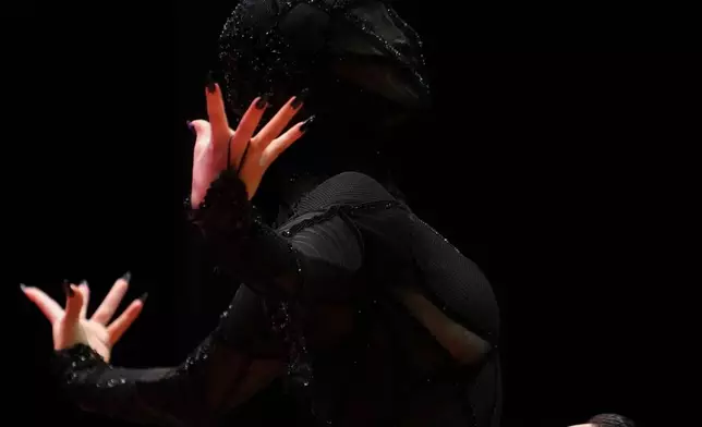 Leandro Bojko and Micaela Garcia compete in the stage category finals of the World Tango Championship, in Buenos Aires, Argentina, Sept. 2, 2025. (AP Photo/Natacha Pisarenko, File)