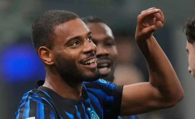 Inter Milan's Andy Diouf celebrates his side's opening goal during the Italian soccer cup round of sixteen match between Inter Milan and Venezia, at the San Siro stadium in Milan, Italy, Wednesday, Dec.3, 2025. (AP Photo/Luca Bruno)