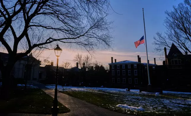 The U.S. flag flies at half-staff on the Main Green in honor of the victims of the campus shooting at Brown University, Wednesday, Dec. 17, 2025, in Providence, R.I. (AP Photo/Robert F. Bukaty)
