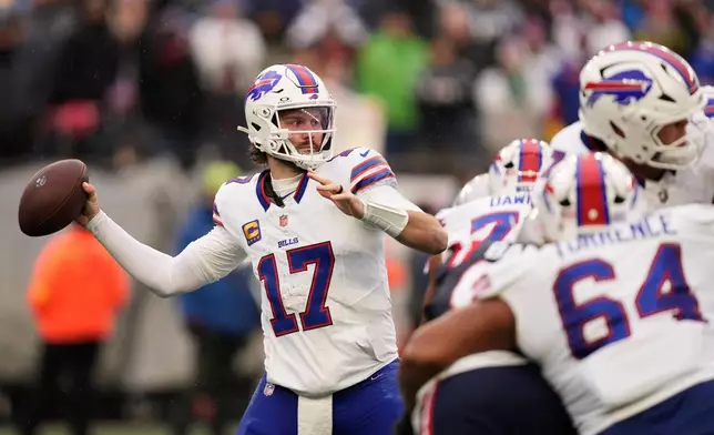 Buffalo Bills quarterback Josh Allen (17) passes against the New England Patriots during the second half of an NFL football game in Foxborough, Mass., Sunday, Dec. 14, 2025. (AP Photo/Charles Krupa)