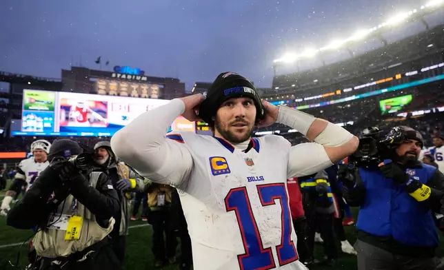 Buffalo Bills quarterback Josh Allen (17) reacts after an NFL football game against the New England Patriots in Foxborough, Mass., Sunday, Dec. 14, 2025. (AP Photo/Charles Krupa)